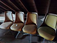 Four swivel chairs in attic setting showing overall condition and matching design.
