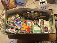 Shoebox filled with assorted baseball cards showing player images and statistics on card backs.