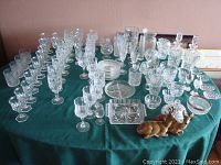 Full overview of crystal glassware, porcelain deer figurines, and various serving pieces