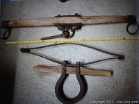 Full view of both wooden ox yoke and iron-horse shoe spring assembly, with measuring tape indicating length around 41 inches.