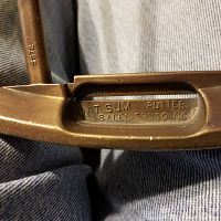 Close-up photo of the putter head showing engraved text 'Dat Sum Putter by Len-Ernco Inc, made in USA' on metal surface.