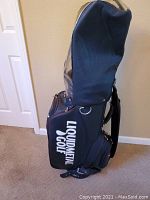 Front view of the Liquidmetal black stand golf bag with white Liquidmetal Golf logo