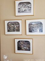 All four framed prints hung on wall in diamond configuration