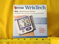 Original retail box showing product photo and features including irregular heartbeat detector and one touch operation.