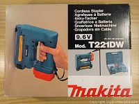 Photo of the original Makita T221DW stapler box showing image and model details