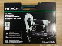 Front view of the closed Hitachi NT 50AE2 Brad Nailer box showing branding, model, and tool image.