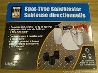 Closed box photo of the PowerFist Spot-Type Sandblaster showing branding, product info and required air pressure and flow.