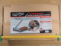 Sealed cardboard packaging showing Proxtro branding and product image with ruler for scale