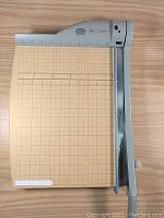 Top view of the GBC ClassicCut CL310pro-L showing the cutting arm, grid base and laser guide area.