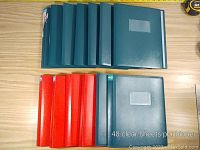 13 presentation binders laid out, 8 blue and 5 red, for 8.5 x 11 inch sheets, showing quantity and colors.