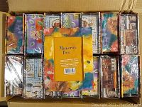Top-down view of 15 Memories Boxes in colorful frame designs, arranged in a box for sale.