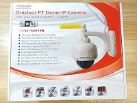 Image of FOSCAM Outdoor PT Dome IP camera box showing specifications and features including pan 355°, tilt 90°, night vision up to 15m, IR cut filter, wireless connectivity.