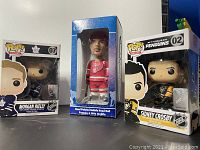 Front view showing all three items: Steve Yzerman bobble head standing in blue box, Funko Pop Morgan Reilly and Sidney Crosby in their retail boxes