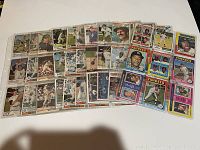 Front side image showing 90 different New York Yankees baseball cards from the 1970s featuring player images and classic card designs.