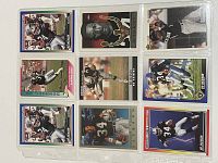 Nine Bo Jackson sports cards displayed in plastic sleeves, showcasing 8 football cards and 1 baseball card in various action and portrait poses.