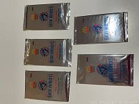 Lot of 5 unopened 1992 McDonald's Toronto Blue Jays Great Moments baseball card packs laid out on a white background.