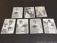 Front view of the 7 1969 Topps baseball card inserts featuring black and white player images with deckle edges and printed signatures.