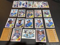 Photo of laid out cards showing individual 1988 Topps Toronto Blue Jays players in team uniforms.