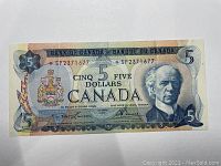 Front view of 1972 $5 Canadian replacement banknote with prefix SP2371677 showing portrait of Sir Wilfrid Laurier and serial number.