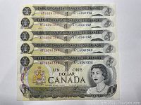 Front and back of five consecutive 1973 Canadian one-dollar banknotes