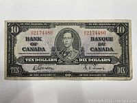 Front of 1937 $10 Bank of Canada banknote showing King George VI portrait, serial number O/D 21774480.