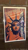 Front angled view showing full laminated poster with clear colors and text: 'NEW YORK The Wonder City'.