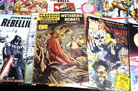 Front view of assorted comics including Star Wars Rebellion and Classics Illustrated Wuthering Heights