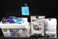 Display of the NASCAR die-cast collectible cars with original packaging and labels.