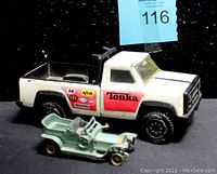 Side view of Tonka truck showing decals and 1907 Rolls Royce Silver Ghost car in front