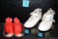 Pair of bright orange Nike Mercurial Superfly 6 Elite CR7 kids indoor soccer shoes size 5Y and white Laser 7.9 MX women's rollerskates size 6 with blue wheels showing front and side view.