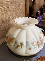 Large milk glass lamp shade with ruffled edge and hand-painted floral pattern