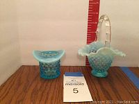 Front view of the two glass items: a hobnail basket with a clear handle and a hobnail top hat vase, showing size comparison with a ruler.