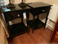 Both nightstands side by side showing overall condition and style, crystal-like drawer knobs visible.