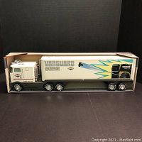 Side view of the NYLINT Vanguard Sound Machine Semi truck inside original box showing full length and graphics on trailer.