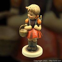 Front view of the Hummel school girl figurine showing detailed paint and figure design.