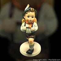 Front view of the Hummel School Boy figurine showing facial features, clothing details, and base.