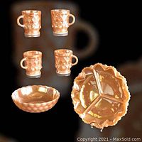 Overview of the full set showing 4 mugs, divided dish, and bowl in peach lustre finish