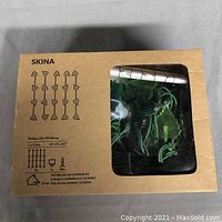 Front of box showing SKINA string light with 48 ivy-shaped LED bulbs, size 39.25 x 63 inches, suitable for indoor/outdoor use.