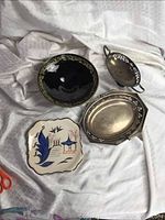 Additional photo for clearer view of the serving dishes, amethyst glass bowl, and ceramic dish with decor.