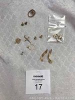 Group shot of all jewelry pieces on patterned white surface