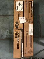 Laminating film packaging boxes showing label and branding for Avery Dennison CrystalClear industrial laminating film.