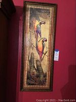 Full view of framed print showing two macaws and the frame detail.