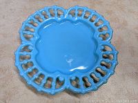 Top view of the blue opaline glass plate showing scalloped center and intricate lace-like openwork rim in excellent condition.