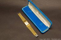 Seiko LaSalle wrist watch and blue presentation box on brown surface