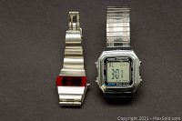 Front view of two wristwatches, Casio digital and red LED display with metal bands.
