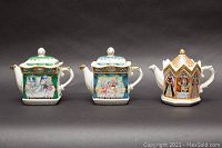 Front view of three Sadler lidded teapots