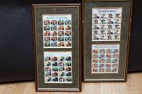 Two framed collections of US postage stamps, each featuring multiple sheets of 'Legends of American Music' series. One frame has two sheets with the titles 'Songwriters' and 'Big Band Leaders', the other has a larger sheet titled 'Broadway Songwriters' and another below it titled 'Modern Composers'. Stamps show various iconic music figures.