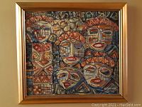 Front view of abstract oil painting with multiple stylized faces, framed in gilt wood.