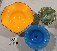 Top view showing three glass bowls: large yellow, medium blue, small greenish