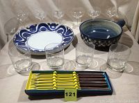 Photo of 2 ceramic bowls, 6 stemmed glasses, 4 tumblers, and 6 fondue forks in original box.